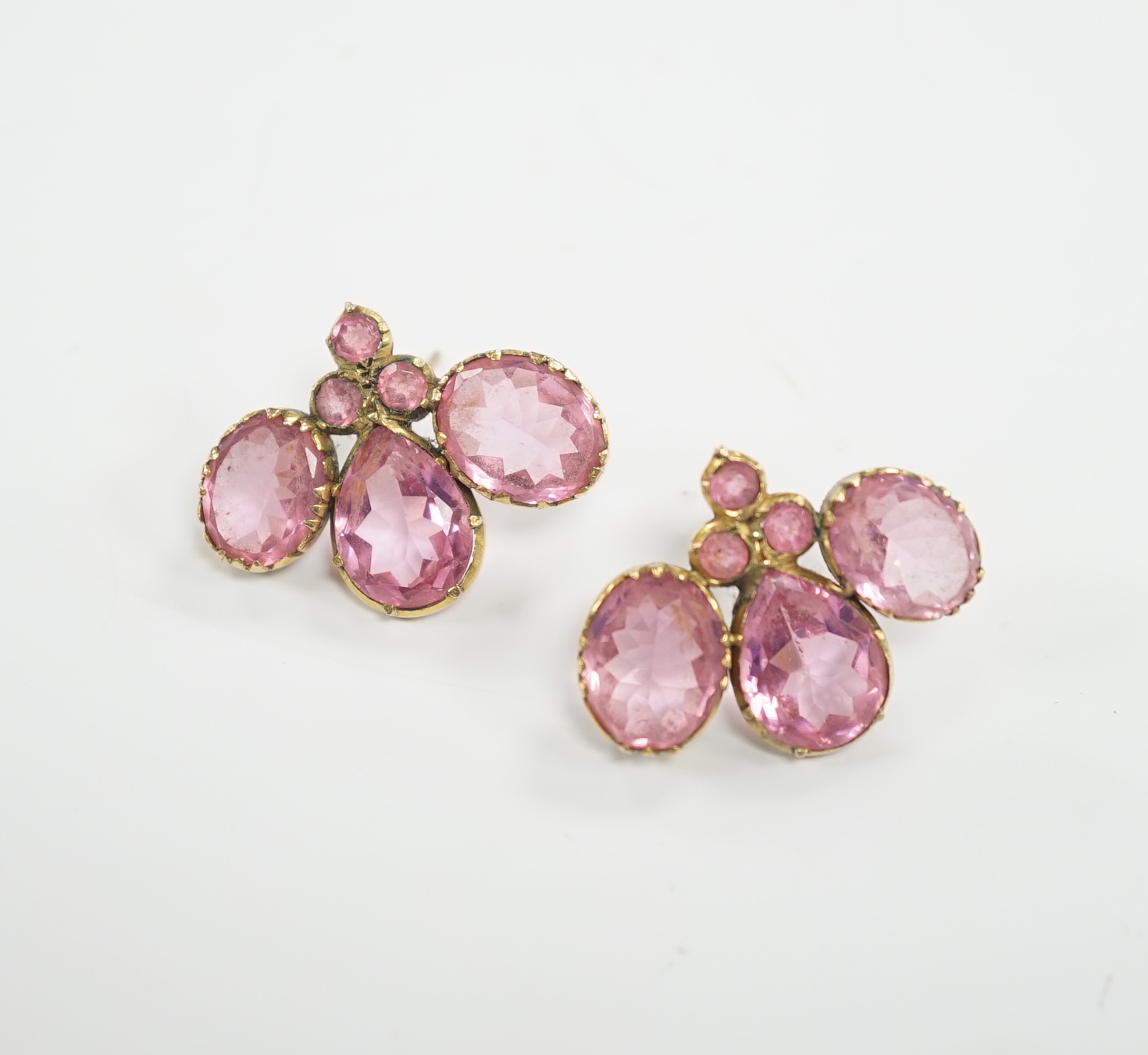 A pair of early 20th century yellow metal and pink paste cluster ear studs, width 26mm, gross weight 8.2 grams.